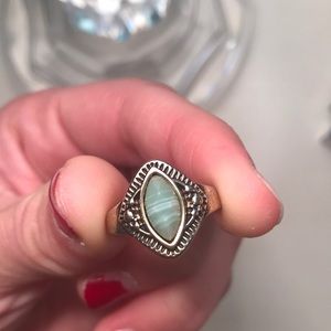 gold ring with turquiose stone in the center